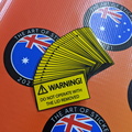 210115-bulk-custom-printed-contour-cut-die-cut-warning-do-not-operate-vinyl-business-safety-stickers.jpg
