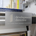 210930-custom-printed-contour-cut-die-cut-development-directive-white-ink-clear-vinyl-business-logo-stickers.jpg